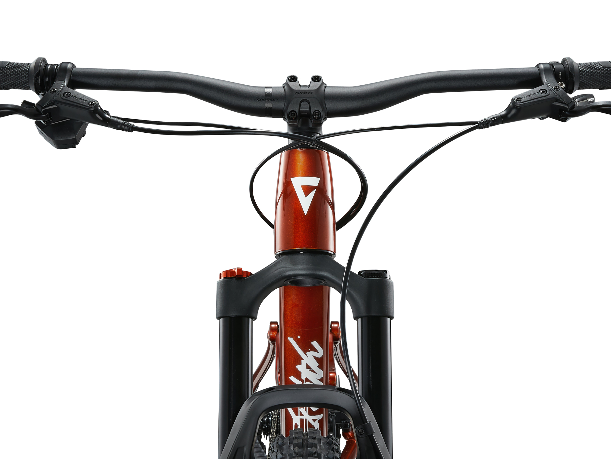 Giant Faith Mountainbike in Kupfer mit breitem Lenker und Federgabel in Frontansicht.